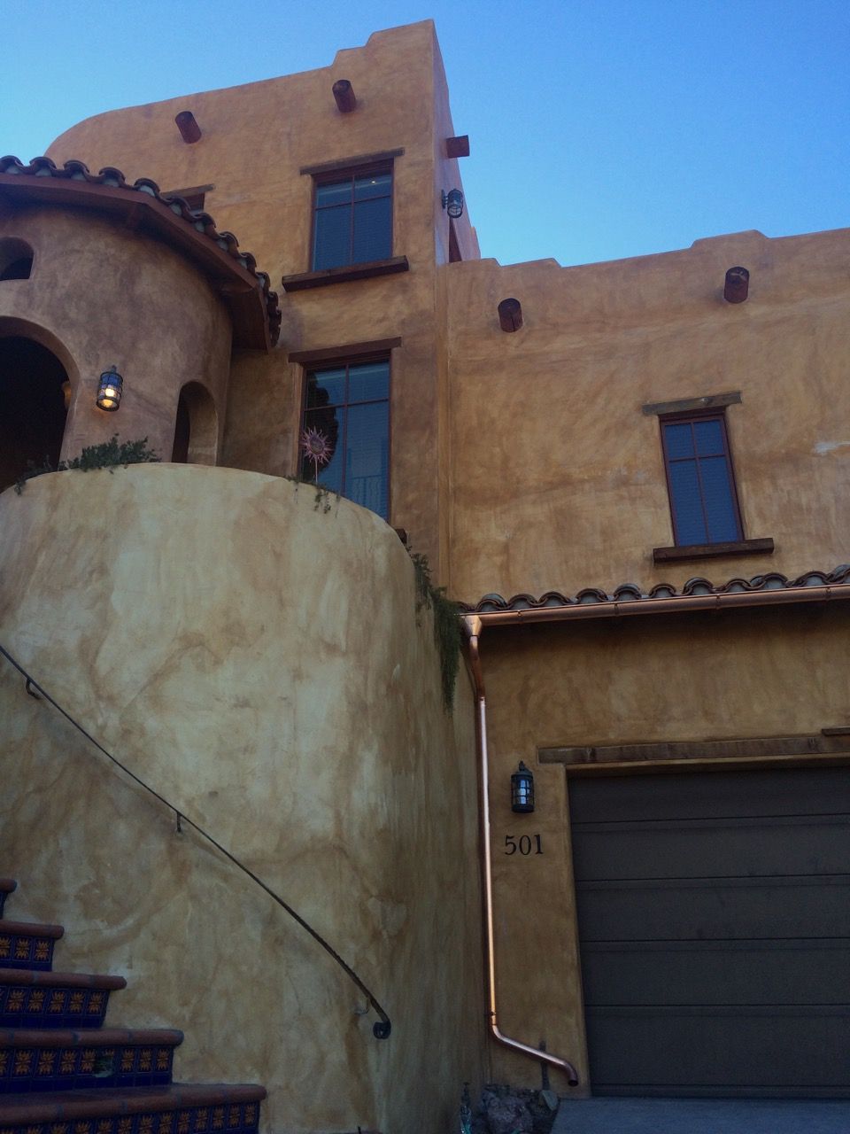Pueblo-style home with tile accents